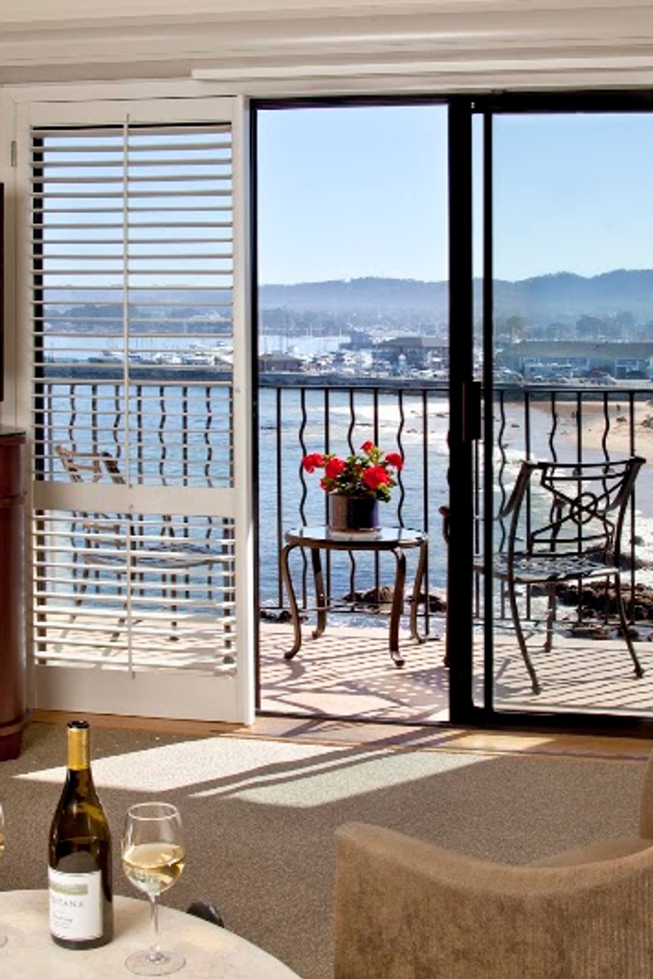 Photo of Monterey Bay Inn - Ocean Harbor View Room, private balcony and one king bed with luxury euro-top bedding