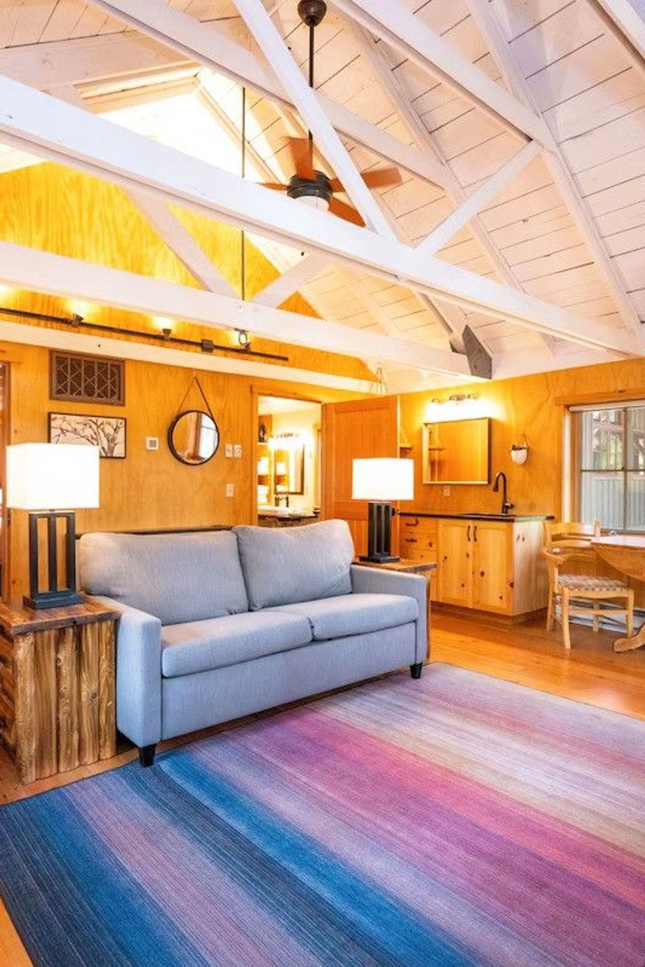 Photo of Sleeping Lady Mountain Resort & Spa - Library Cabin – Living room with a wood-burning stove