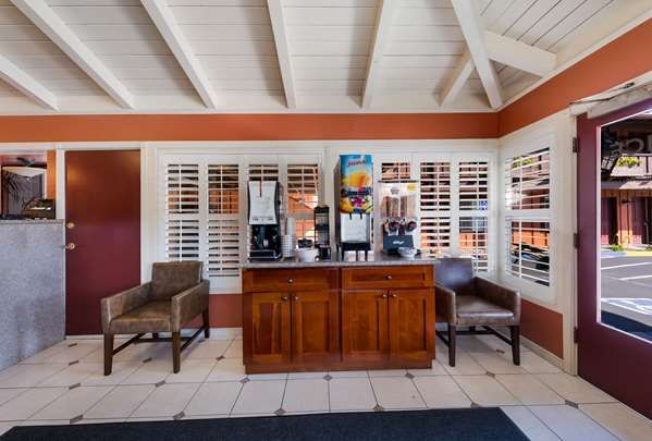 Photo of Clarion Collection Wilkie's Inn Pacific Grove - Monterey - Lobby, fireplace, coffee, tea, flatscreen TV
