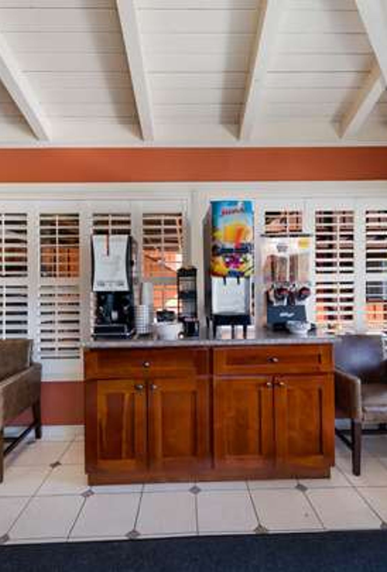 Photo of Clarion Collection Wilkie's Inn Pacific Grove - Monterey - Lobby, fireplace, coffee, tea, flatscreen TV