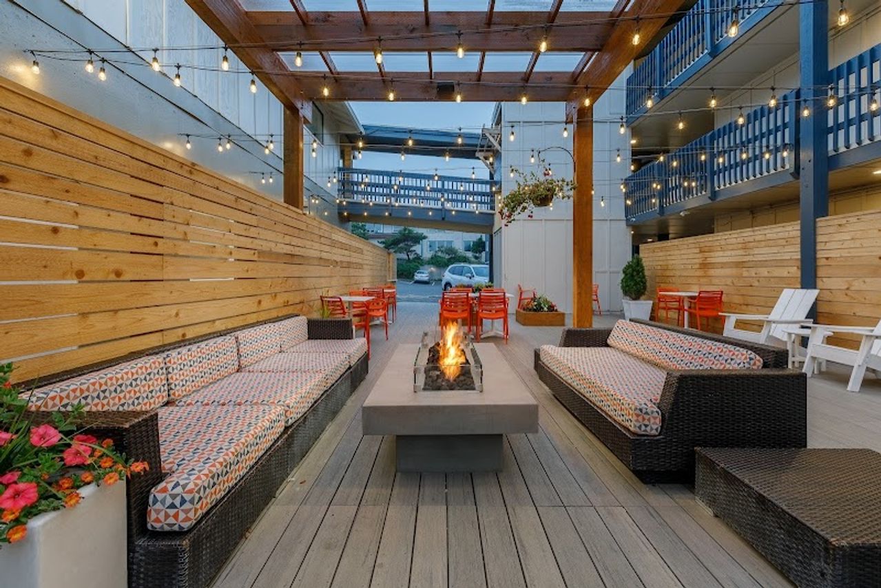 Photo of Surfland Hotel - Outdoor seating area with firepit 
