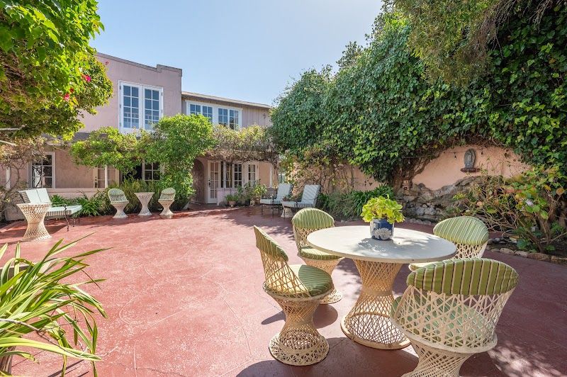 Photo of Martine Inn - Courtyard with koi pond-fountain and outdoor seating area