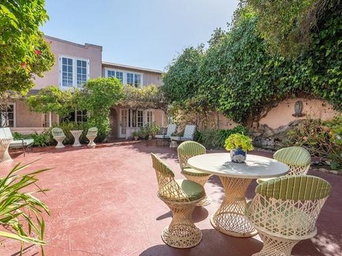 Photo of Martine Inn - Courtyard with koi pond-fountain and outdoor seating area