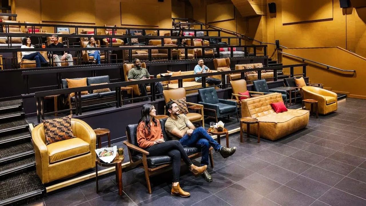 El Capitan Hotel - Cinema with tiered seating and comfortable sofas and armchairs