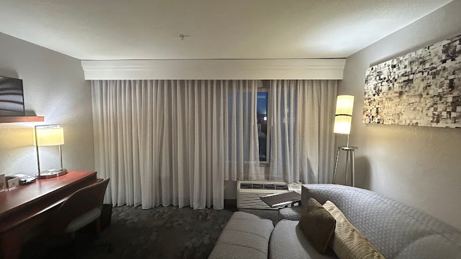 Photo of Courtyard Merced - Suite with comfortable sofa set, armchair, and desk for work or dining