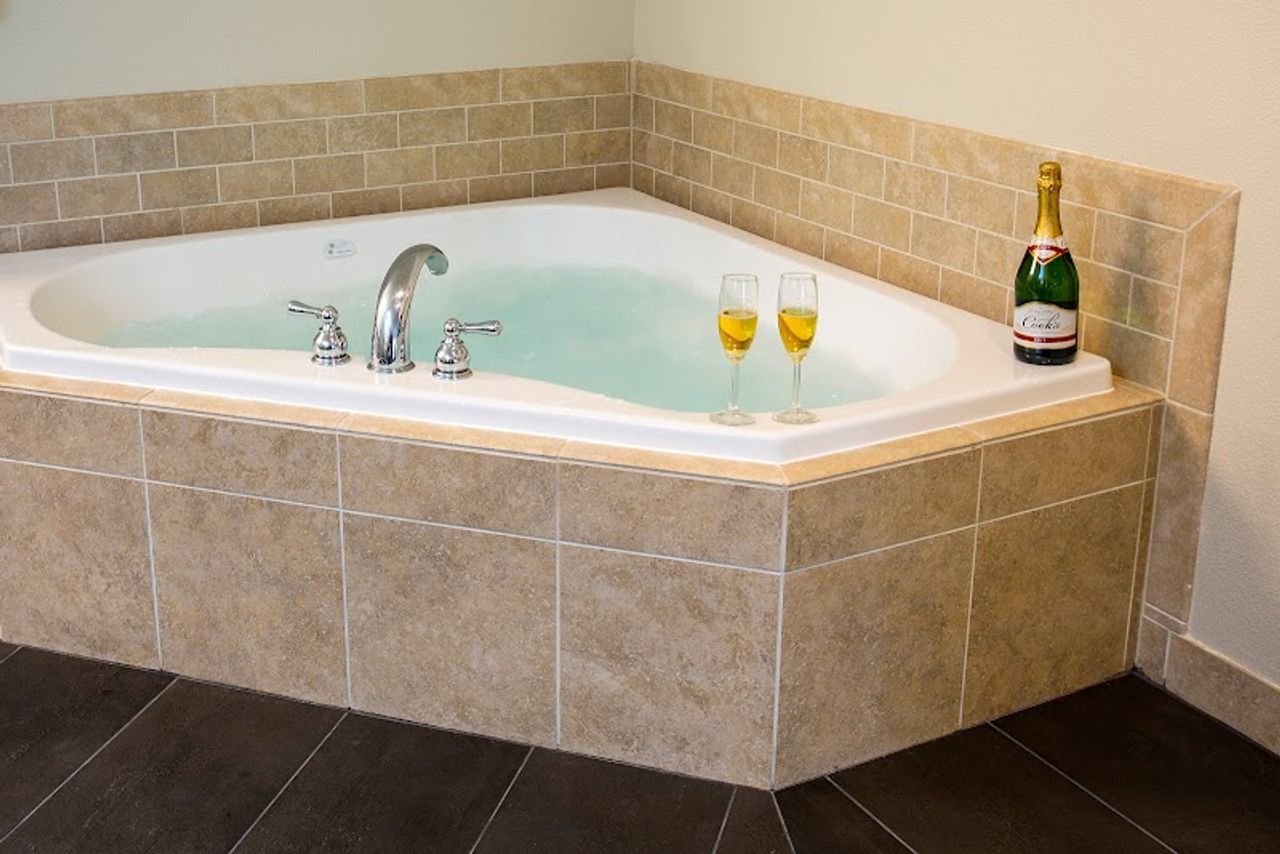 Photo of Looking Glass Inn - In-room whirlpool tub