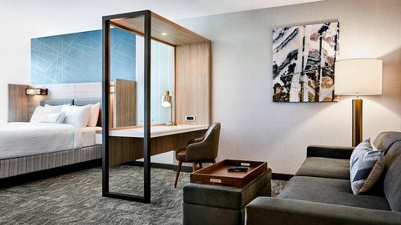 Photo of SpringHill Suites Turlock - Suite, King Bed, Seating Area