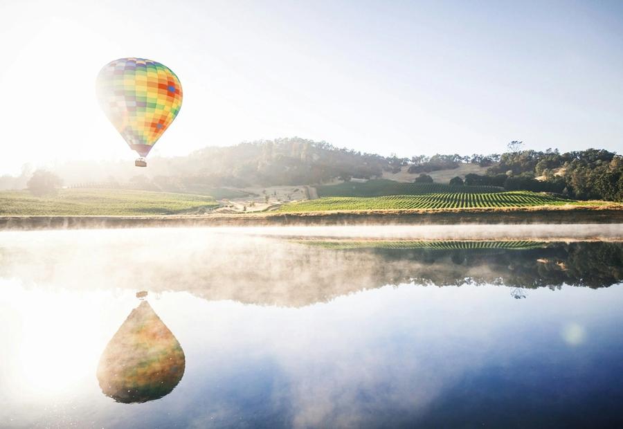 Hot air balloon floating in mid air above Napa Valley, Napa, California, USA