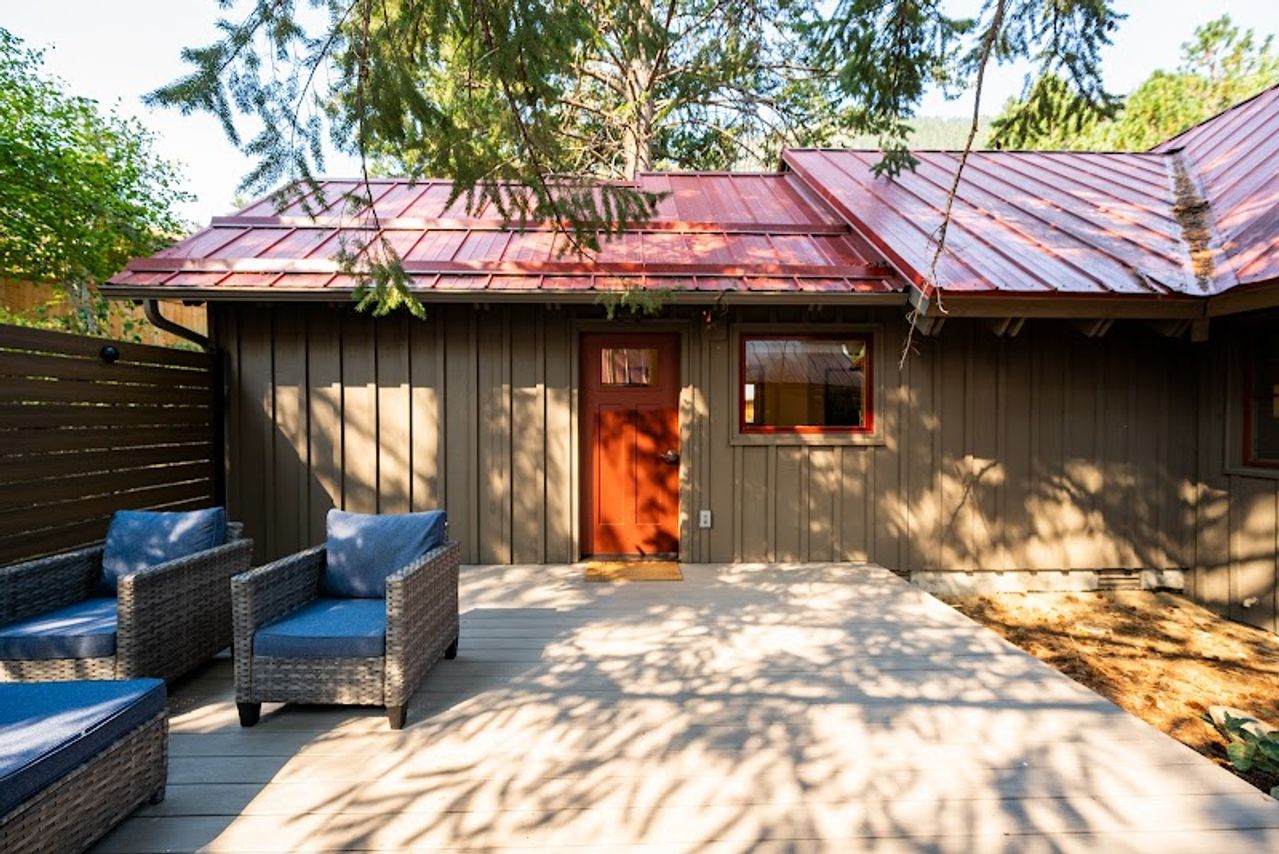 Photo of Sleeping Lady Mountain Resort & Spa - Steller's Jay Cabin, private patio with comfortable outdoor furniture