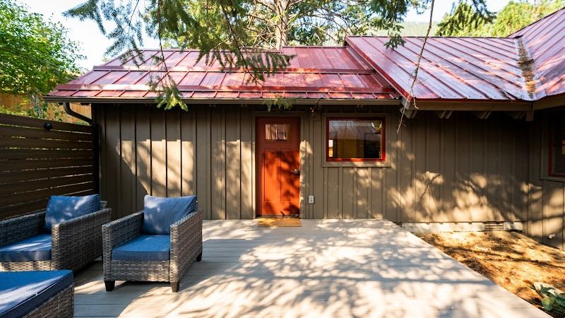Photo of Sleeping Lady Mountain Resort & Spa - Steller's Jay Cabin, private patio with comfortable outdoor furniture