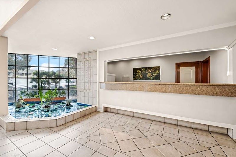 Photo of Best Western De Anza Inn - Lobby, Reception, Indoor Koi Pond