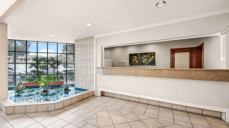 Photo of Best Western De Anza Inn - Lobby, Reception, Indoor Koi Pond