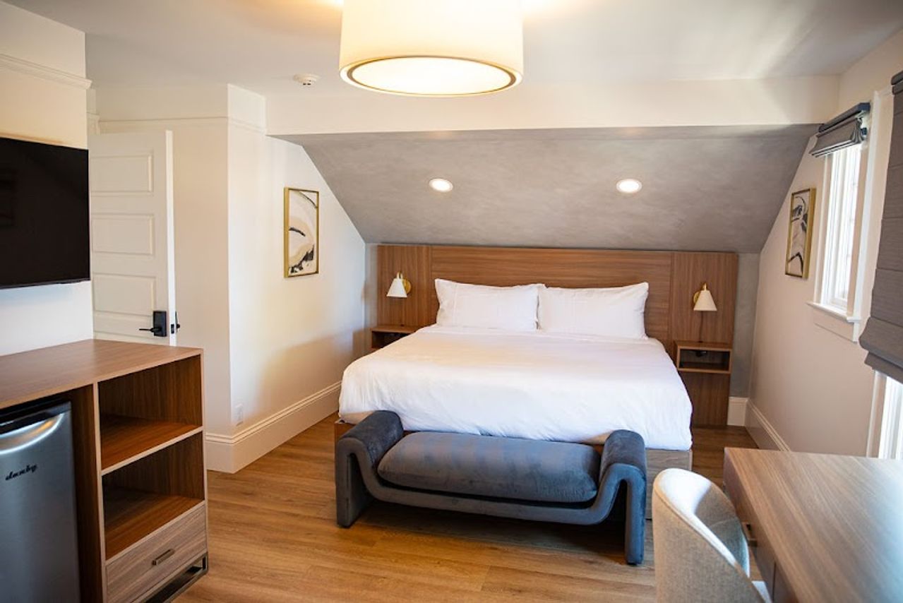 Photo of the compass mcminnville - West suite: 2ND FLOOR* KING SUITE, MOODY PRIVATE BATHROOM WITH A SPACIOUS WALK-IN SHOWER, LOUNGING AREA, WORKING STATION