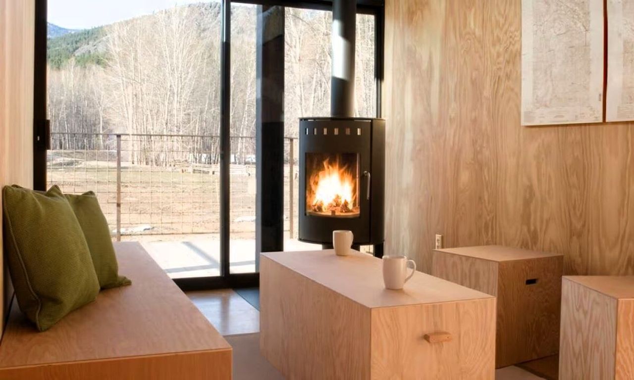 Rolling Huts - Rolling Hut, Living area with Fireplace