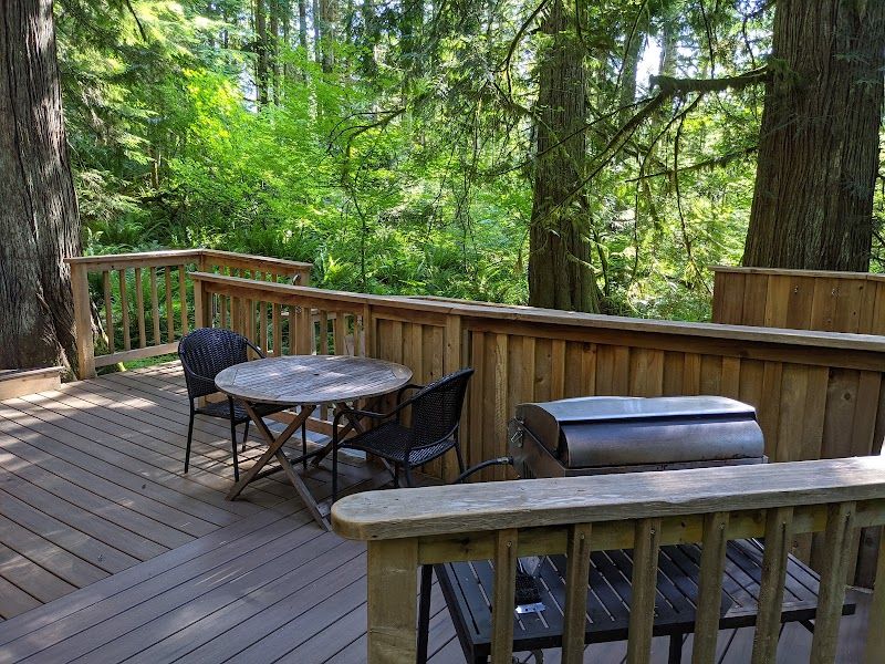 Photo of Deep Forest Cabins - Mt Home Log Cabin, sun deck with table and chairs, gas BBQ and hot tub