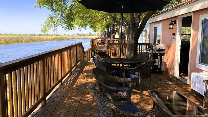 Photo of Village West Marina & Resort - "Waterfront" Bungalow - Terrace, Outdoor seating area, Gas BBQ grill with included propane