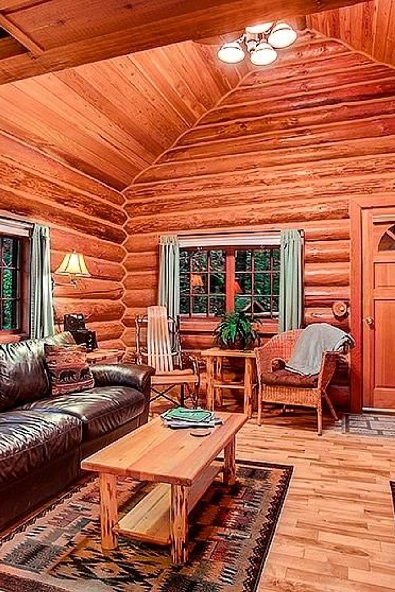 Photo of Deep Forest Cabins - Mt Home Log Cabin, Living room, fireplace, sofa