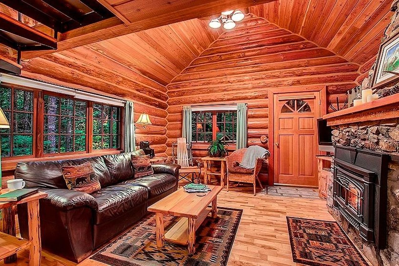Photo of Deep Forest Cabins - Mt Home Log Cabin, Living room, fireplace, sofa