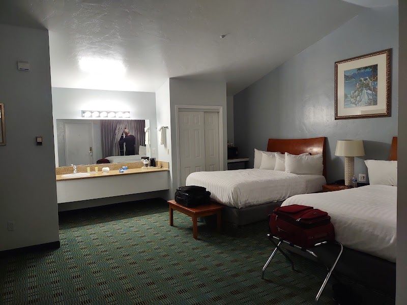 Photo of Butterfly Grove Inn - 2 Queen room, microwave and refrigerator, coffee maker, flat-screen TV