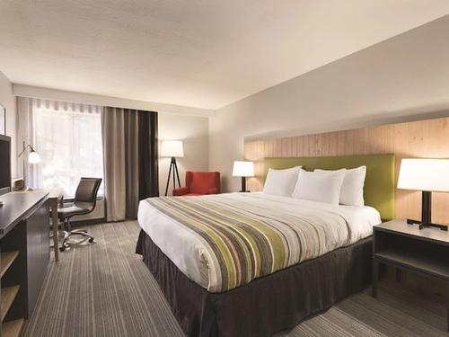 Photo of Country Inn & Suites by Radisson, Monterey Beachfront-Marina, CA - Room, King Bed, Work Desk, Flat TV