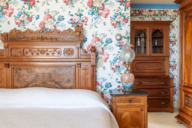 Photo of Martine Inn - The Suite, with king-size bed, a wood-burning fireplace, outstanding views, a bathroom with a clawfoot tub and separate shower