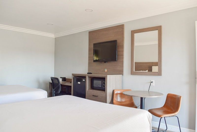 Photo of Lone Oak Lodge - Room, 2 Queen Beds, Table, 2 Chairs, Work Desk, Flat TV, Fridge, Microwave