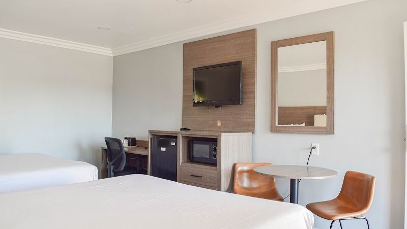 Photo of Lone Oak Lodge - Room, 2 Queen Beds, Table, 2 Chairs, Work Desk, Flat TV, Fridge, Microwave