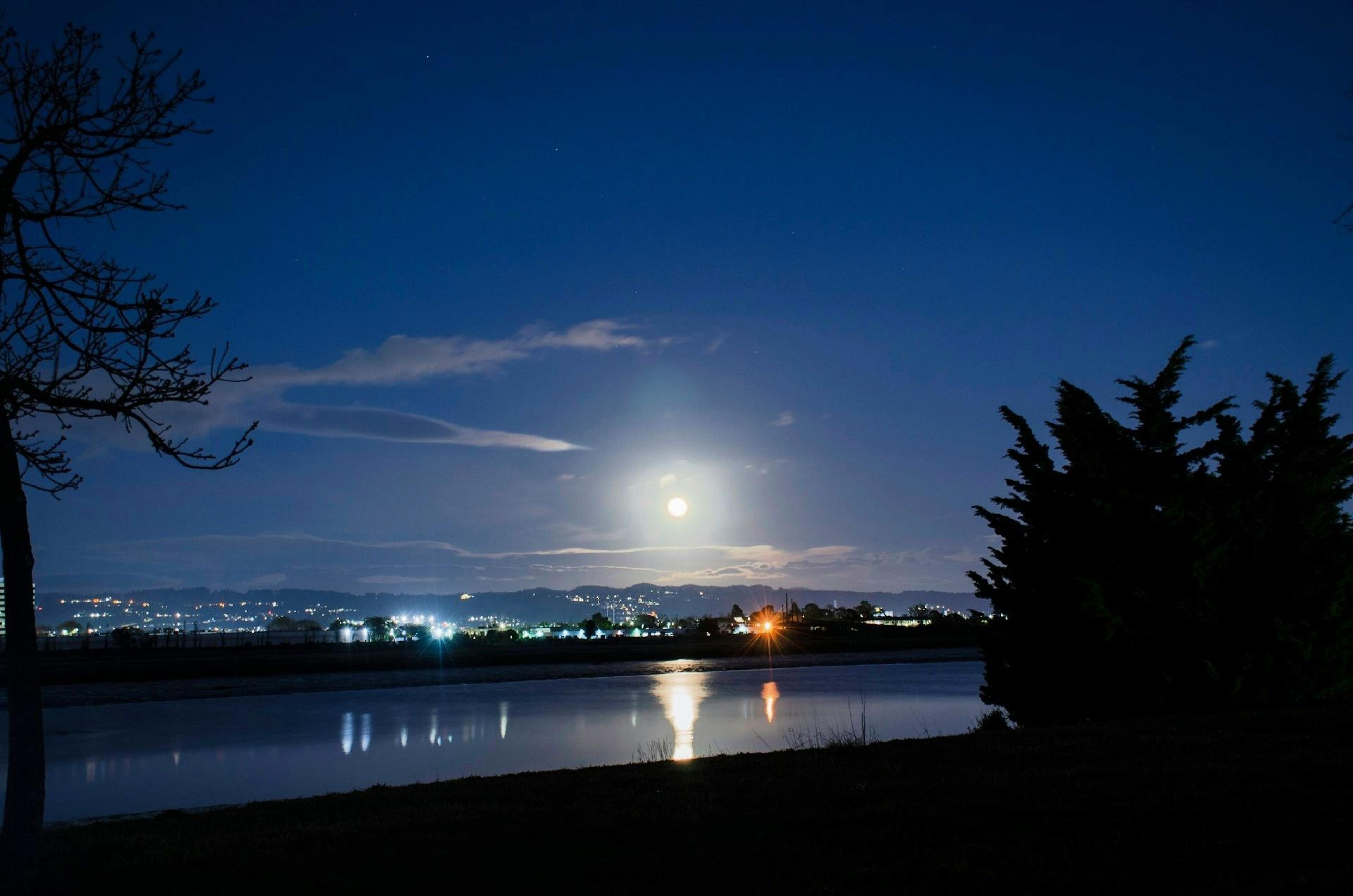 A fool moon in the night sky over San Leandro, CA, USA