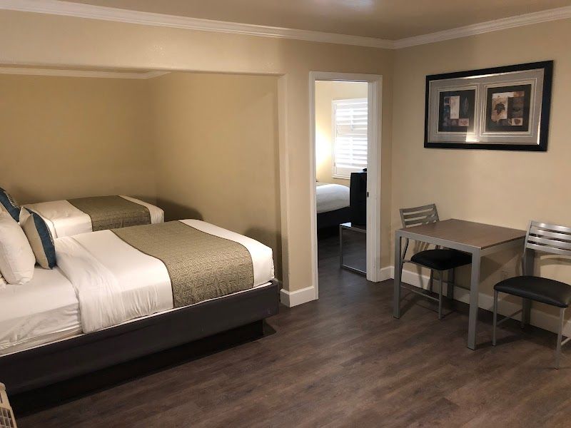 Photo of El Castell Motel - Suite, 2 Queen Beds, Table & 2 Chairs