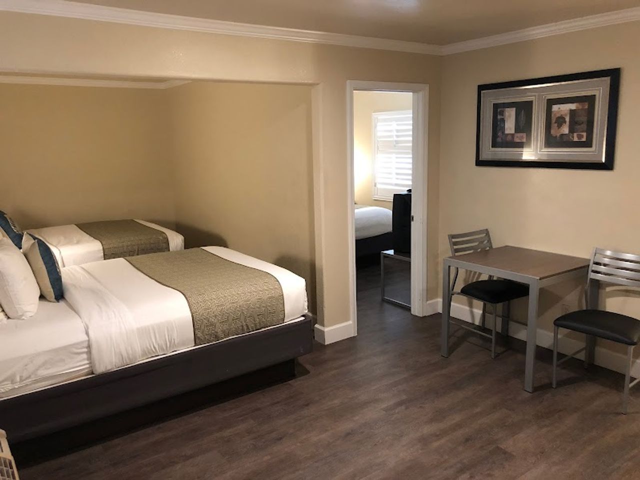 Photo of El Castell Motel - Suite, 2 Queen Beds, Table & 2 Chairs