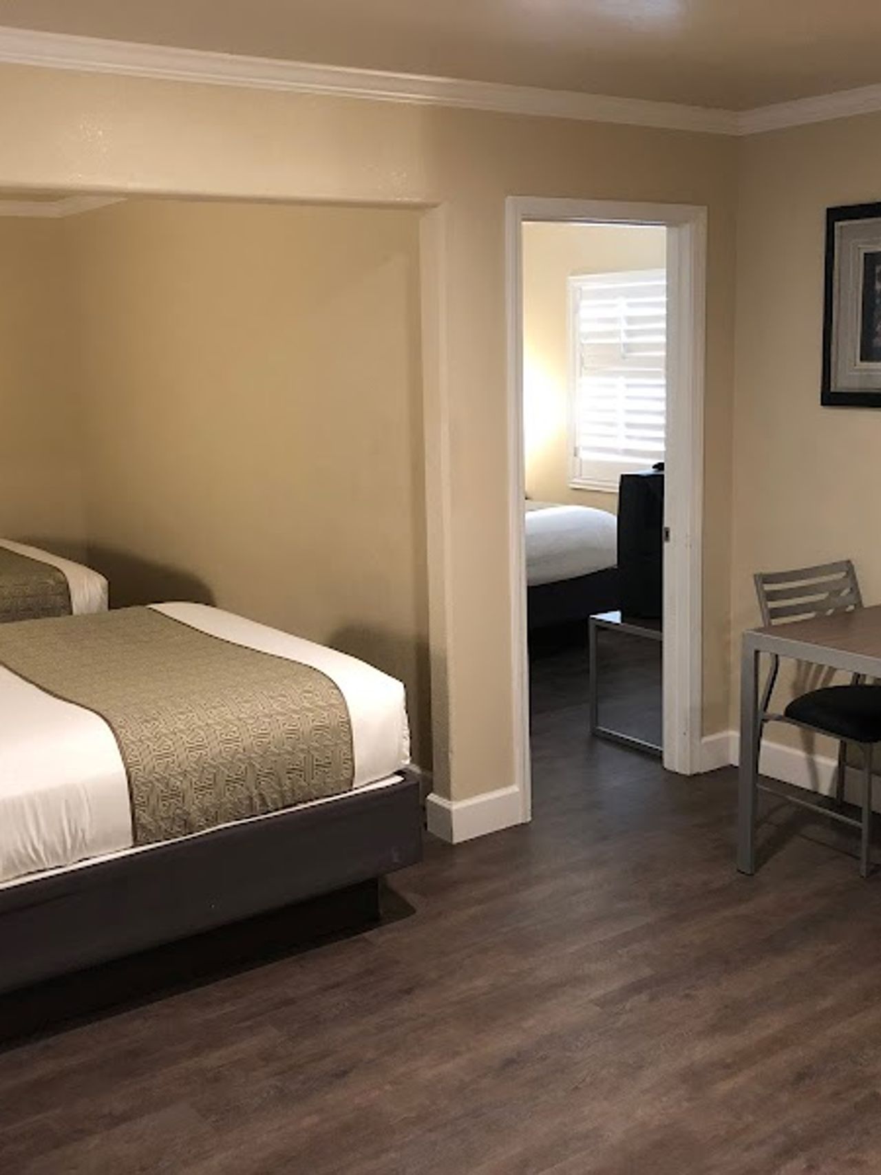 Photo of El Castell Motel - Suite, 2 Queen Beds, Table & 2 Chairs