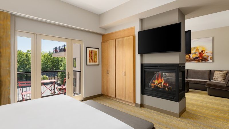 Photo of Inn at the 5th Eugene - Suite, Separate bedroom and living area, King Bed, Fireplace, Private terrace