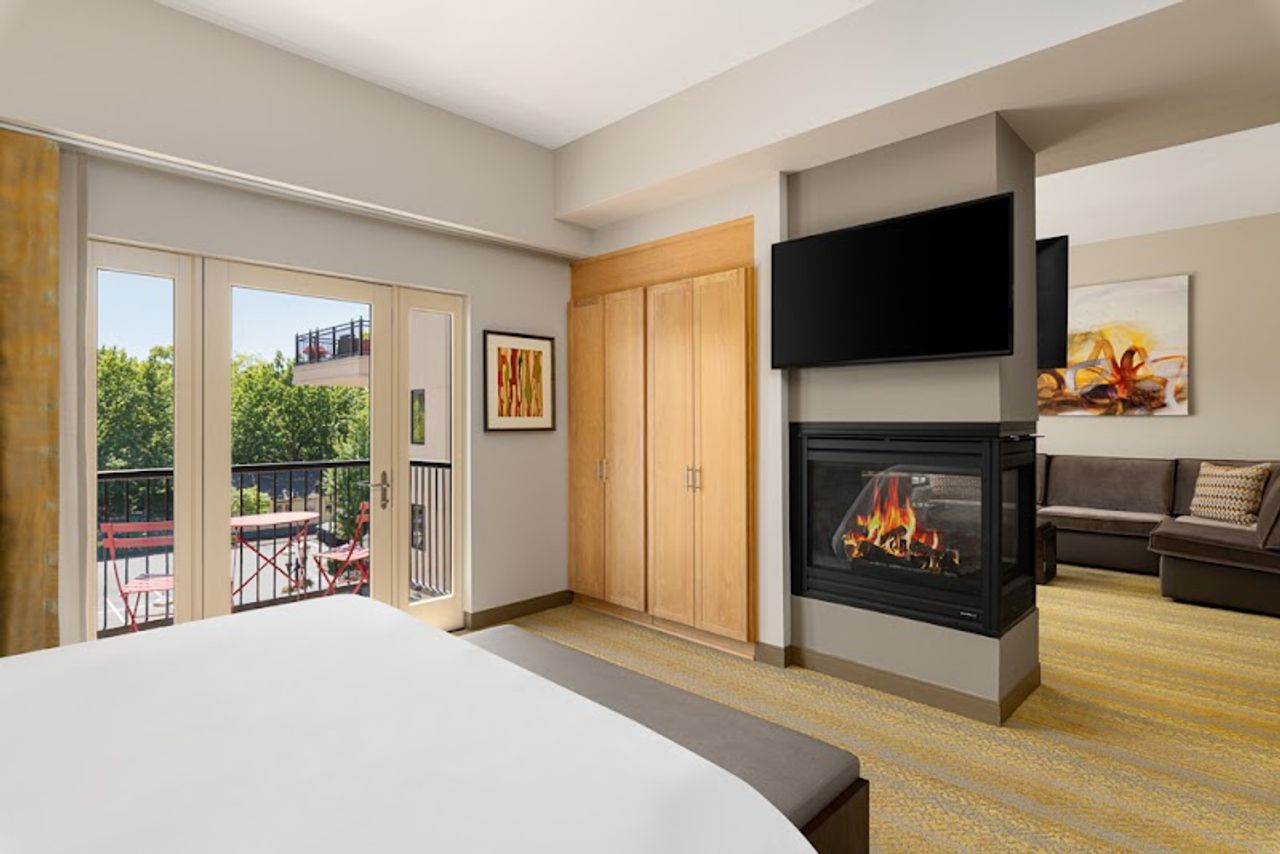 Photo of Inn at the 5th Eugene - Suite, Separate bedroom and living area, King Bed, Fireplace, Private terrace