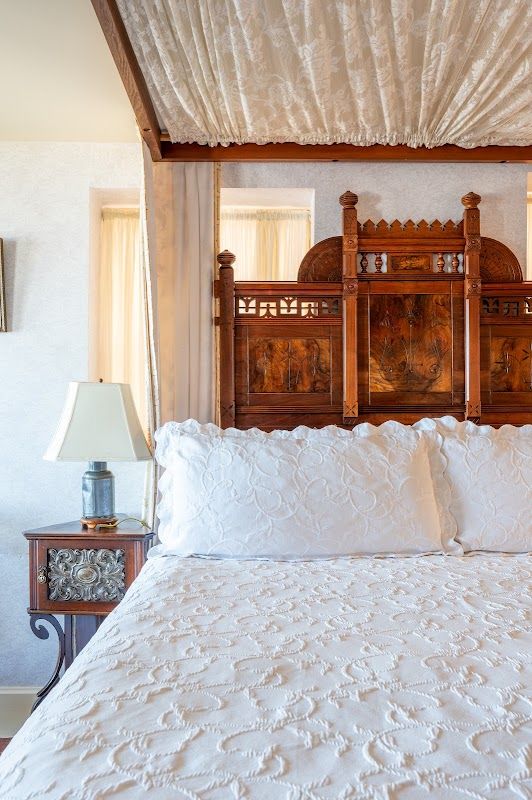 Photo of Martine Inn - Eastlake Room with a king-size bed on a raised dais