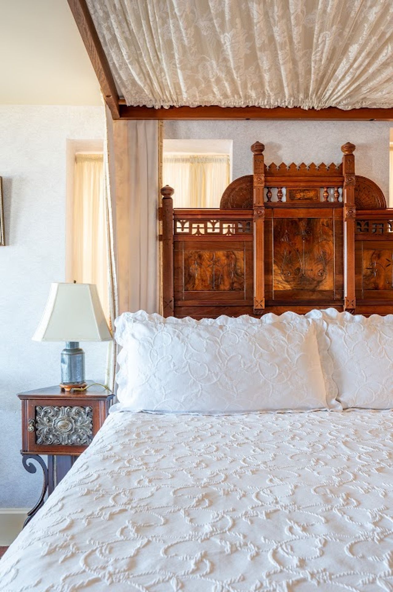 Photo of Martine Inn - Eastlake Room with a king-size bed on a raised dais
