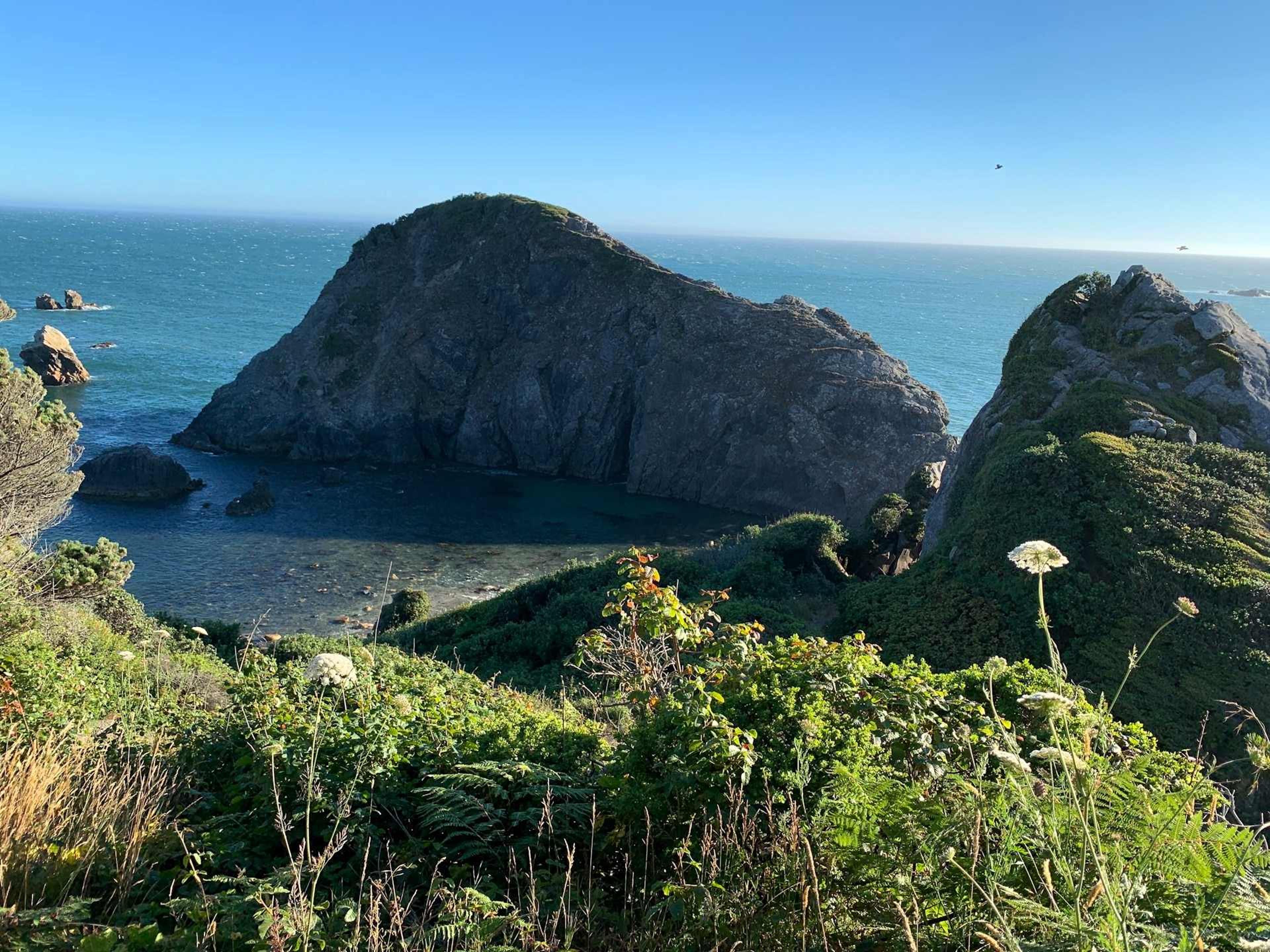 View of the cove at Harris Beach State Park from the highway looking over the Pacific ocean near Brookings and Harbor, Oregon