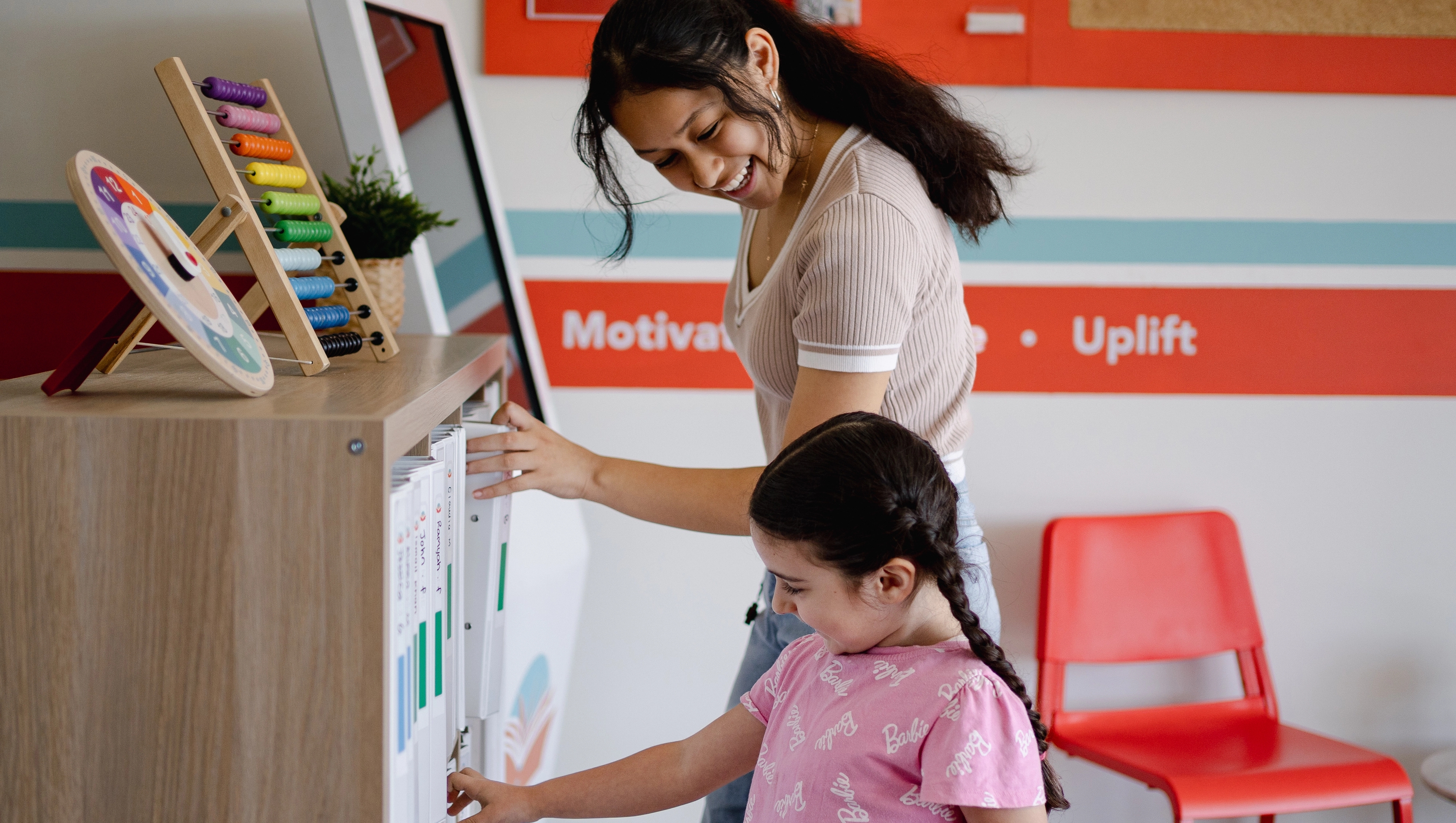 A little student standing next to each other in Success Tutoring centre