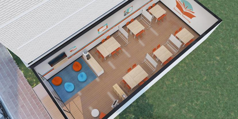an aerial view of a classroom with tables and chairs .