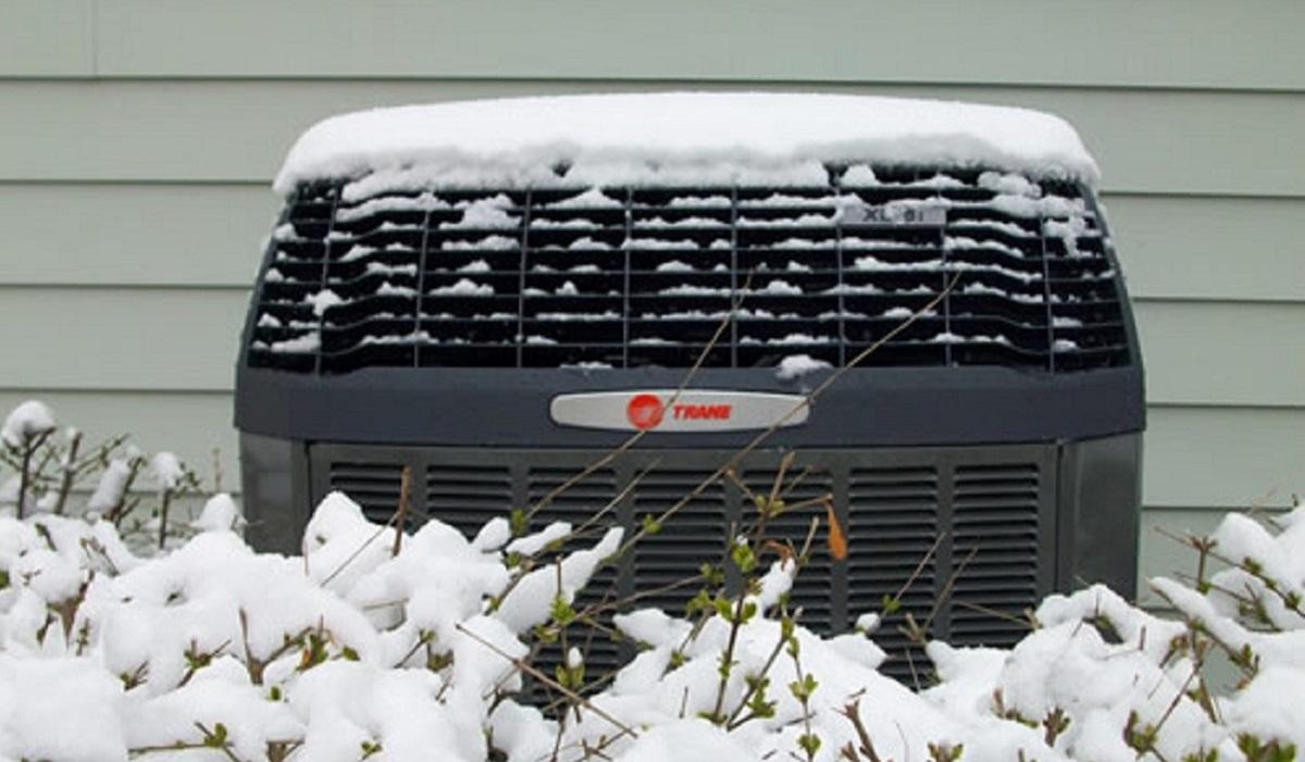 Trane heat pump in winter snow provided by SS&B Heating & Cooling.