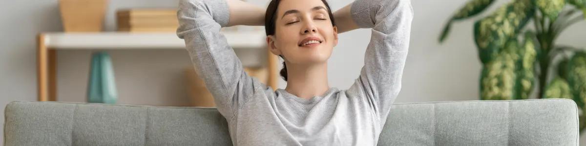 Woman relaxing in a SS&B Heating & Cooling serviced home, enjoying the comfort of clean indoor air.