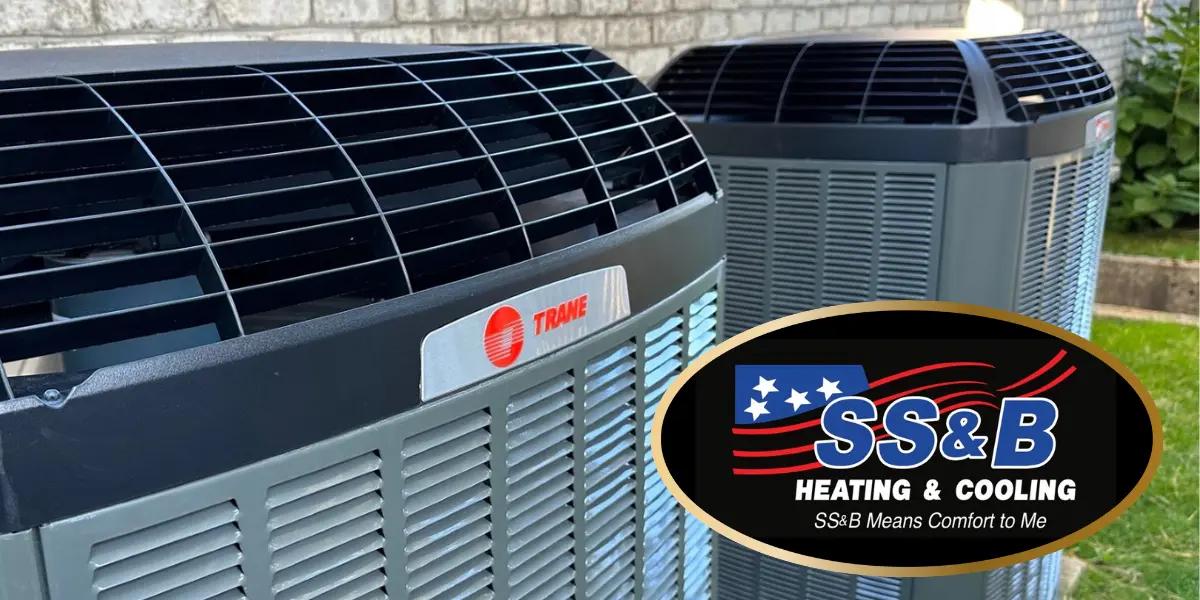 Two Trane outdoor units illustrating the difference between heat pumps and air conditioners. The SS&B Heating & Cooling logo highlights trusted HVAC expertise.