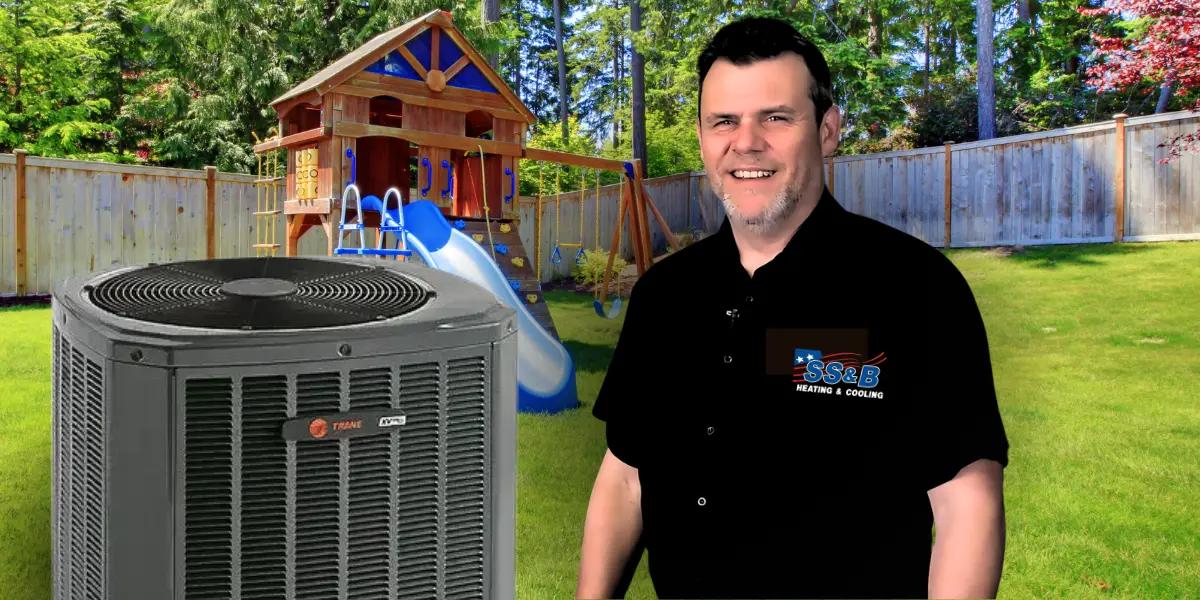 Tom stands beside a Trane XV17 Variable Speed Heat Pump in a child-friendly backyard, showcasing efficient comfort.