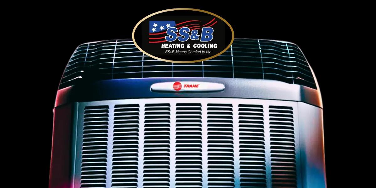 A high-efficiency Trane air conditioning unit with SS&B Heating & Cooling branding, representing professional HVAC services in Springfield, MO. The system showcases advanced cooling technology for energy-efficient home comfort.