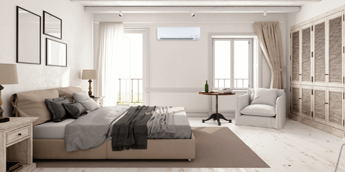 A Trane Single Zone Ductless Mini Split provided by SS&B Heating & Cooling. The mini split is white and has a sleek design. It is located on the wall of a home and is being used to provide heating and cooling to the home.