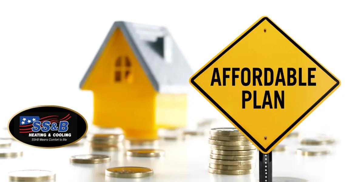 Yellow road sign reading 'Affordable Plan' next to a stack of coins and a miniature yellow house in the background, featuring the SS&B Heating & Cooling logo in the foreground. Represents cost-effective HVAC financing options.