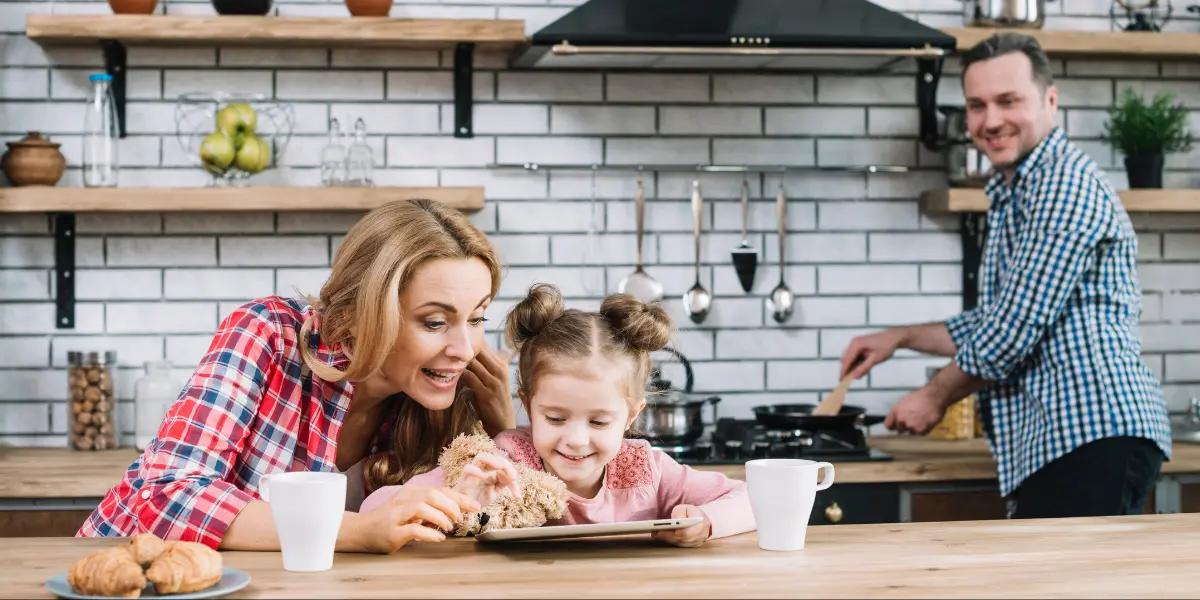 Family enjoying time in a cozy kitchen, symbolizing the comfort SS&B Heating & Cooling brings.
