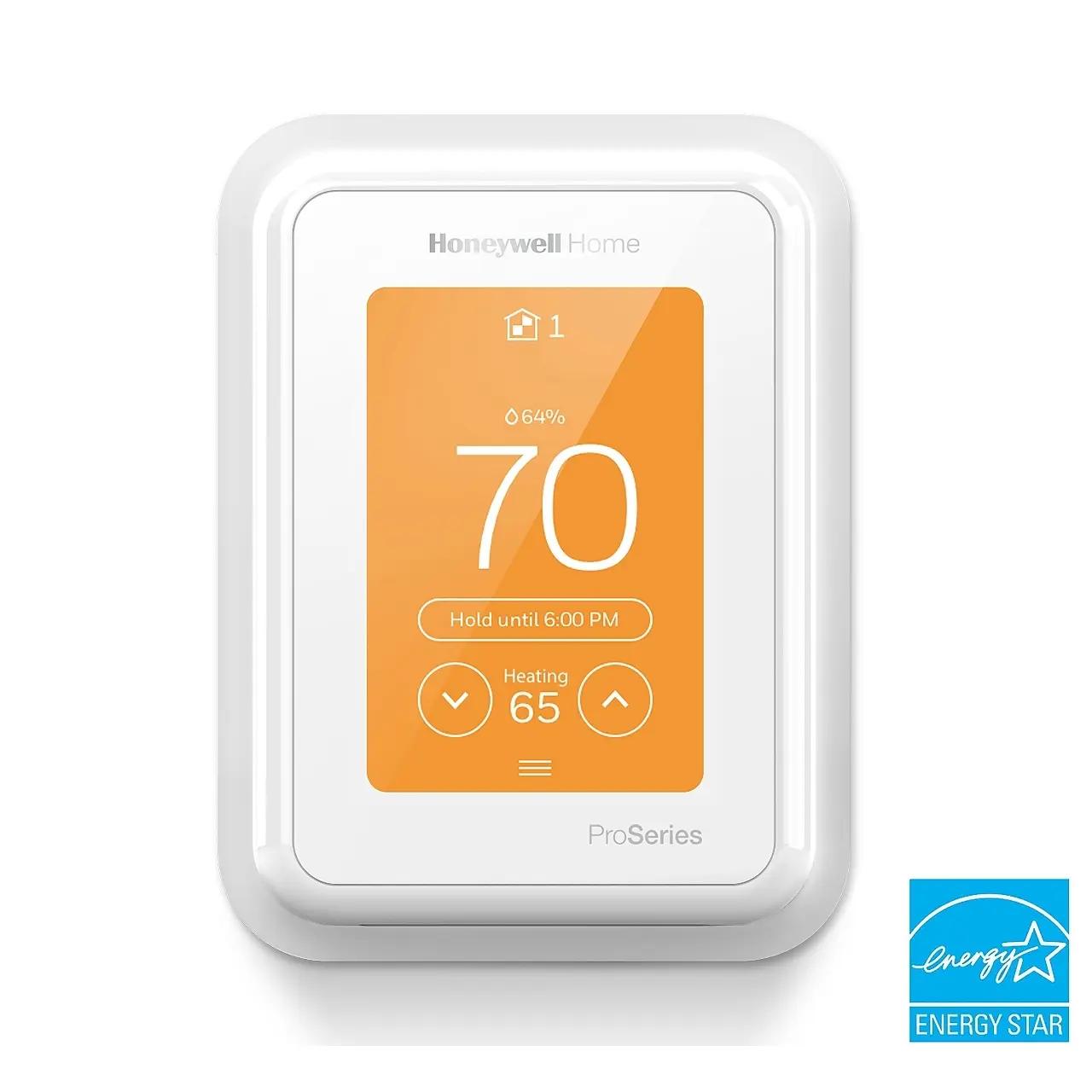 Front view of a Honeywell Home T10 Pro Smart Thermostat with an orange digital display showing a current temperature of 70°F and a heating setting of 65°F. The thermostat features a white frame and the Energy Star logo is visible in the bottom right corner.