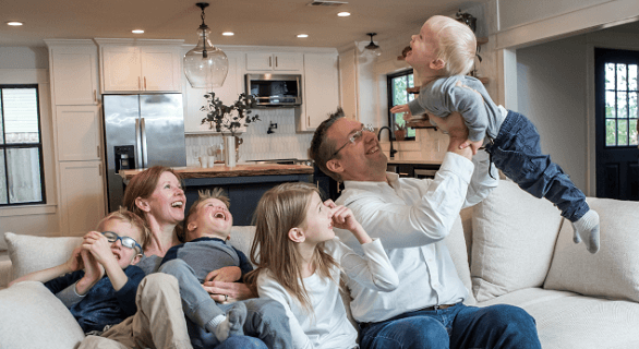 Family inside home: Air Scrubber indoor air quality.