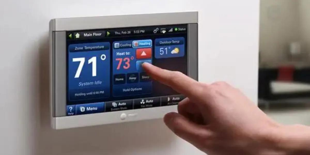 A hand adjusting the settings on a thermostat, demonstrating control over indoor temperature for optimal comfort – a key aspect of SS&B Heating & Cooling's advice on managing summer heatwaves in Springfield, MO.