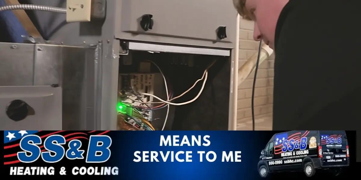 SS&B heating service technician performing a heating tune-up for maximizing heating and cooling efficiency.